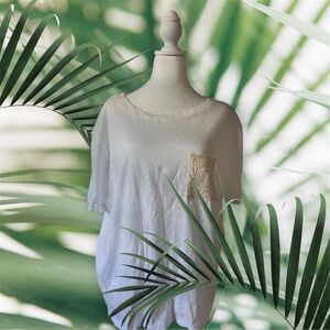 Plus size woman’s white T shirt with pocket.